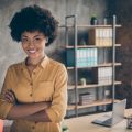 Portrait of cool afro american girl start-up representative agent cross hands, ready decide workforce solution in enterprise office loft